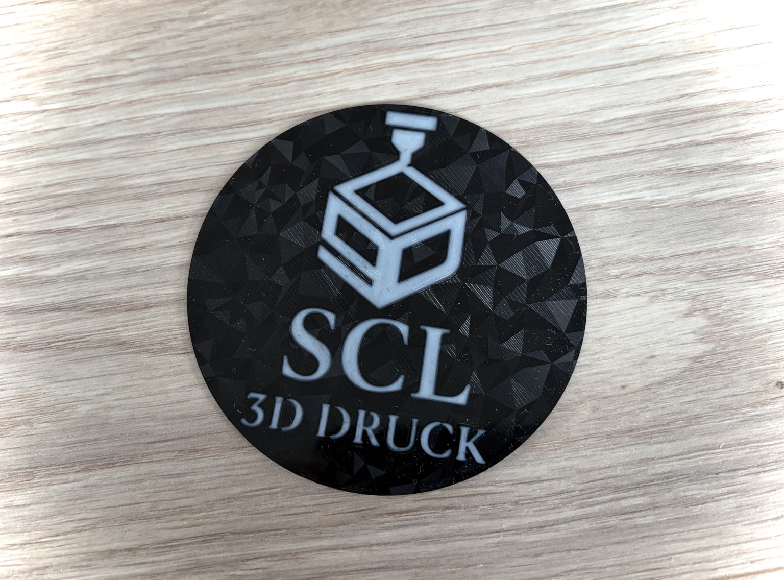 Lasergraviertes SCL Logo als Beispiel für individuelle Gravuren